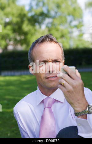 Businessman using a mobile phone, Stockholm, Sweden. Stock Photo