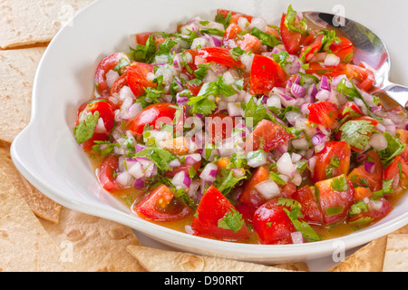 Pico de gallo, or salsa fresca, is a fresh, uncooked relish in Mexican cuisine, made from tomatoes, red onion, Stock Photo
