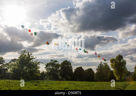 floating string of colourful balloons filled with helium Stock Photo
