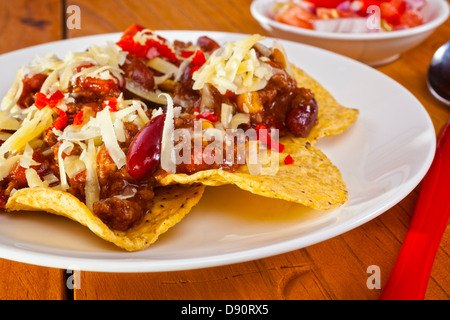 Mexican Beef Nachos - Mexican favourite beef nachos, a delicious combination of beef, beans and salsa, served over... Stock Photo