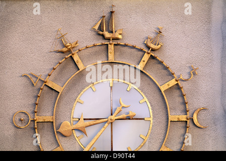Golden wall clock, close-up Stock Photo