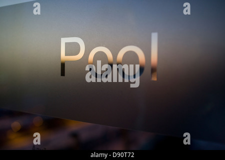 Swimming pool sign on glass Stock Photo