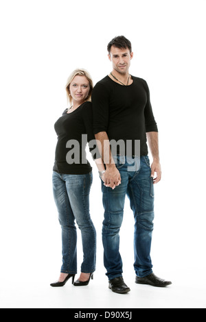 Young couple posing together in studio Stock Photo
