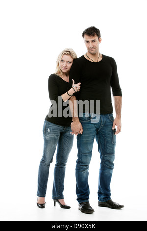 Young couple posing together in studio Stock Photo
