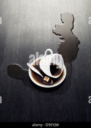 Cup with spilled coffee Stock Photo