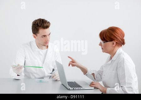 Two scientists working in laboratory Stock Photo