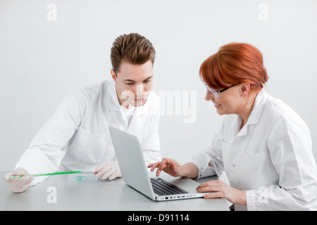Two scientists working in laboratory Stock Photo