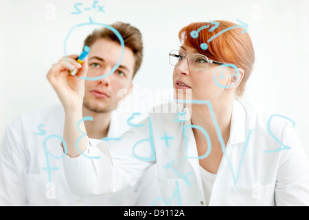Two scientists working in laboratory Stock Photo