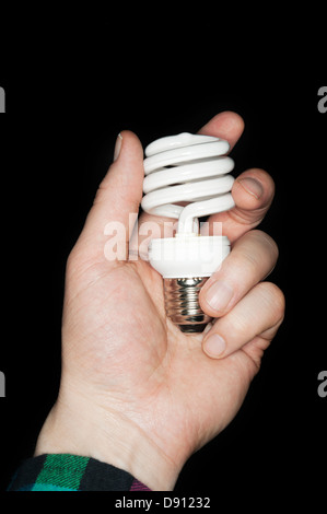 Human hand holding light bulb Stock Photo