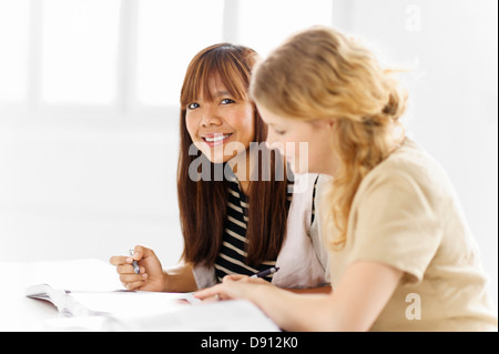 Two female students studying in library Stock Photo