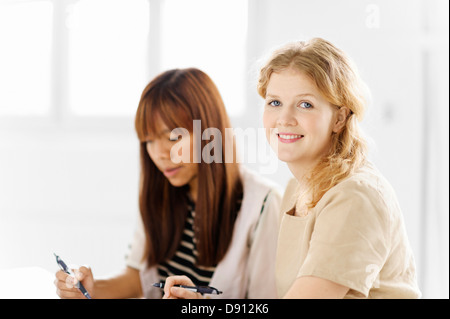 Two female students studying in library Stock Photo