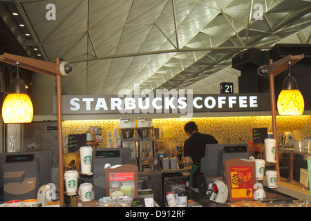 China,Asia,Far East,Orient,Oriental,Hong Kong,International Airport,HKG,terminal,gate,cafe,Starbucks Coffee,barista,cafe,counter,visitors travel trave Stock Photo