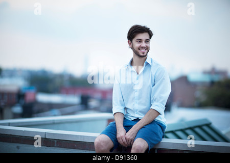 Young smiling man looking away Stock Photo
