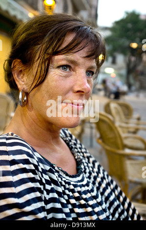 Smiling mature woman looking away Stock Photo