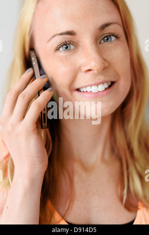 Portrait of young woman using cell phone Stock Photo