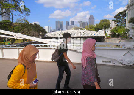 Singapore Singapore River,Boat Quay,Cavenagh Bridge,Asian man men male,woman female women,Muslim,hijab,Sing130201162 Stock Photo