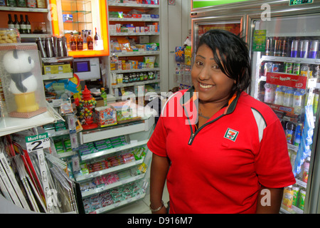 Singapore Kallang Road,Asian woman female women,7-Eleven,convenience,store,uniform,employee worker workers working staff,manager,job,working,work,Sing Stock Photo