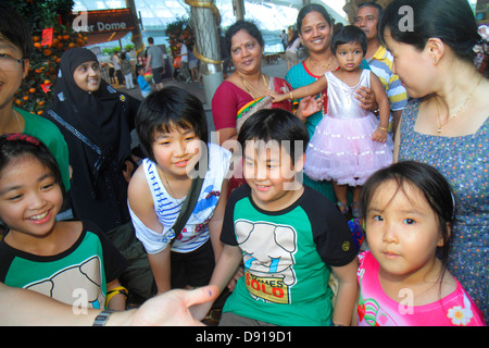 Singapore,Gardens by the Bay water,park,Asian Asians ethnic immigrant immigrants minority,adult adults man men male,magician,entertaining,trick,magic, Stock Photo