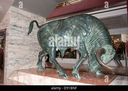 Life Size Bronze Sculpture of A Charging Bull Stock Photo