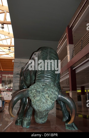 Life Size Bronze Sculpture of A Charging Bull Stock Photo