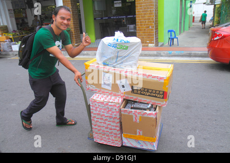 Singapore,Little India,Asian Asians ethnic immigrant immigrants minority,adult adults man men male,cart,boxesdelivery,visitors travel traveling tour t Stock Photo