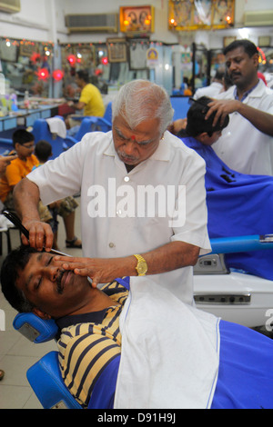 Singapore Little India,Serangoon Road,Asian man men male,barber shop,interior inside,shave,senior seniors citizen citizens,Sing130203049 Stock Photo