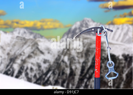 old ice axe for attempting to conquer the summit - austrian alps in the background Stock Photo