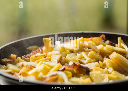 fried potatoes with onions in a frying pan Stock Photo