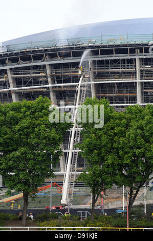 Hydro, Glasgow, Scotland, UK. 8th June 2013. Fire takes a firm hold at the unfinished Hydro arena. Fire spread through the upper floors before the fast action of the Scottish fire service brought the blaze under control. There were already doubts about the project being finished on time before this undoubted setback. Credit:  Douglas Carr/Alamy Live News Stock Photo