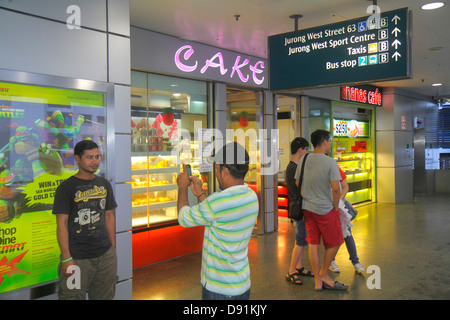 Singapore,Pioneer MRT Station,East West Line,subway train,public transportation,riders,commuters,Asian Asians ethnic immigrant immigrants minority,adu Stock Photo