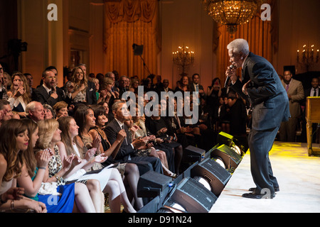 President Barack Obama and First Lady Michelle Obama, along with daughters Malia and Sasha, listen as Eddie Floyd sings &quot;Knock On Wood&quot; during the “In Performance at the White House: Memphis Soul” concert in the East Room of the White House, Apr Stock Photo