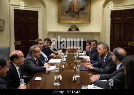 President Barack Obama drops by Deputy National Security Advisor Tony Blinken's meeting with Bahraini Crown Prince and First Deputy Prime Minister Prince Salman bin Hamad Al-Khalifa in the Roosevelt Room of the White House, June 5, 2013. Stock Photo