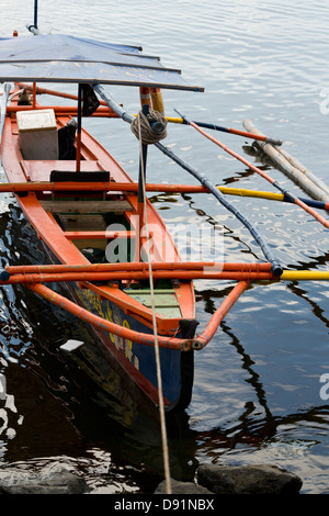 Traditional Outrigger Boat in Manila Bay, Philippines Stock Photo