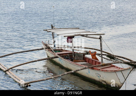 Traditional Outrigger Boat in Manila Bay, Philippines Stock Photo