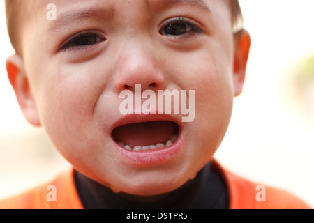 A two year old boy crying Stock Photo