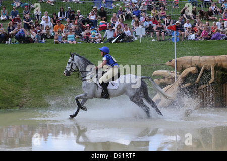 Leeds Bramham UK. 8th June 2013. Emilie Chandler riding Tullibards Showtime, clearing the water obstacle during the cross country event at the 40th Bramham horse trials. Credit: S D Schofield/Alamy Live News Stock Photo