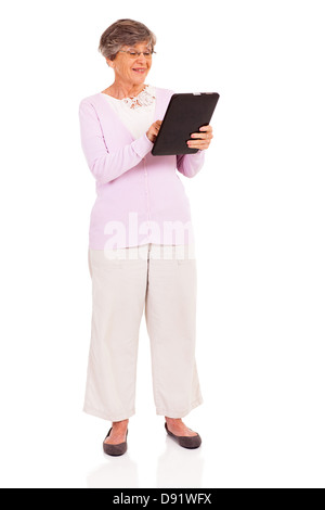 happy senior woman using tablet computer isolated on white Stock Photo