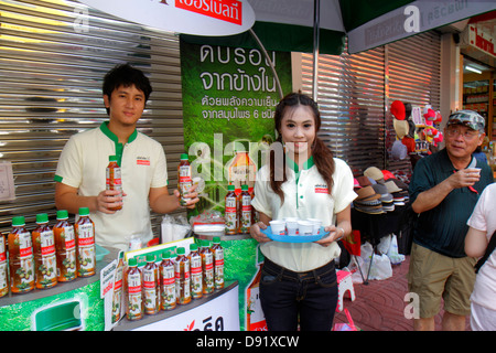 Bangkok Thailand,Thai,Samphanthawong,Chinatown,Yaowarat Road,Asian man men male,woman female women,free sample samples,product,tea,bottled,new product Stock Photo