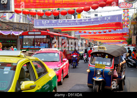 Bangkok Thailand,Thai,Samphanthawong,Chinatown,Yaowarat Road,traffic,taxi,auto rickshaw,tuk-tuk,sam-lor,bus,coach,taxis,cab,cabs,bus,coach,motorcycle, Stock Photo