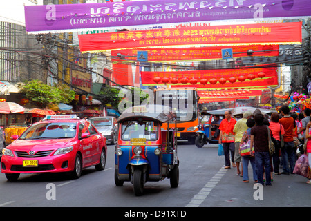 Bangkok Thailand,Thai,Samphanthawong,Chinatown,Yaowarat Road,traffic,taxi,auto rickshaw,tuk-tuk,sam-lor,bus,coach,taxis,cab,cabs,bus,coach,banners,Chi Stock Photo