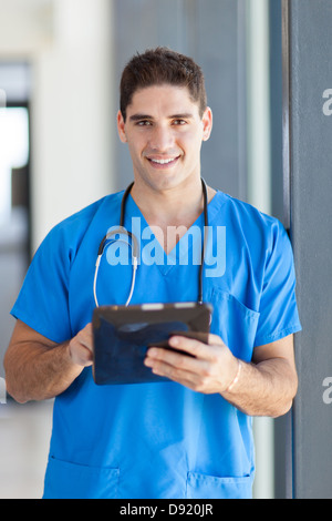 male medical doctor using tablet computer in hospital Stock Photo
