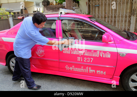 Bangkok Thailand,Thai,Pathum Wan,Soi Kasemsan 1,Rama 1 Road,Asian man men male,taxi,cab,driver,cleaning,car,job,working,work,Thai130212001 Stock Photo