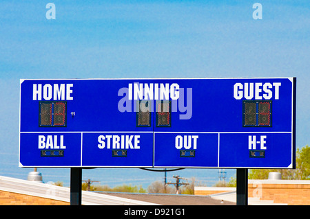 Baseball scoreboard with blue skky in the background. Stock Photo