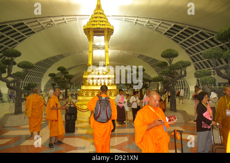 Bangkok Thailand,Thai,Suvarnabhumi International Airport,BKK,terminal,gate,Buddhist,shrine,Asian man men male,monk,robe,kasaya,Thai130214097 Stock Photo