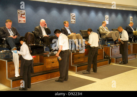 Texas,South,Southwest,Houston,George Bush Intercontinental Airport,IAH,gate,shoe shine,service,man men male,customers,TX130129031 Stock Photo