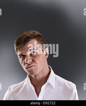 Portrait of a surprised and incredulous man on a black background Stock Photo
