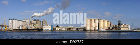Coal burning energy plant with container terminal and river in foreground, Amsterdam, the Netherlands, Europe Stock Photo