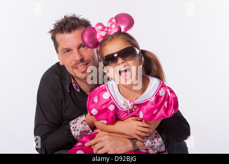 Father and daughter together in studio shoot with white background Stock Photo