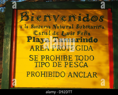 Yellow sign with Spanish text Stock Photo