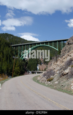 One of only two steel arch bridges in the state of Colorado, the Eagle River bridge near Red Cliff spans the river in 470 feet. Stock Photo